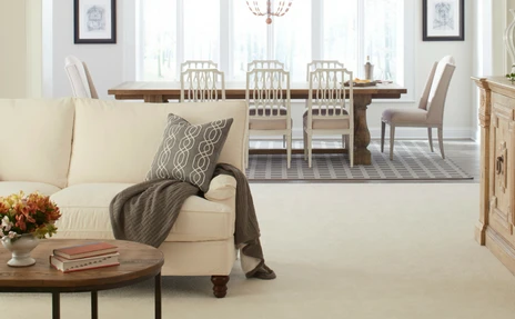 karastan carpet in living rom with beige sofa